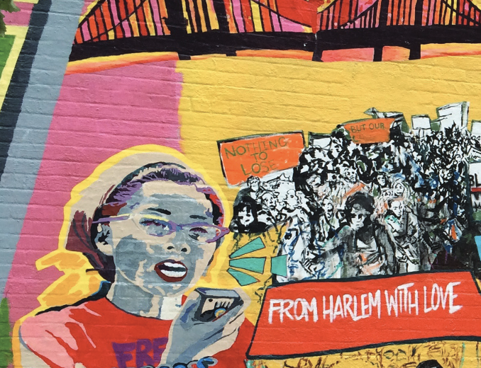 A colorful mural showing prominent Asian-American activist Yuri Kochiyama speaking into a megaphone to a crowd with a banner reading 'From Harlem with Love'